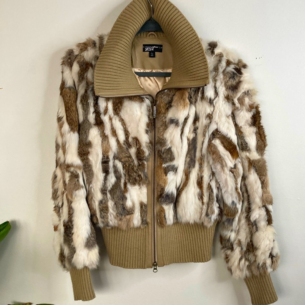 Lined, furry jacket, knit turtleneck collar, cuffs, and waist
